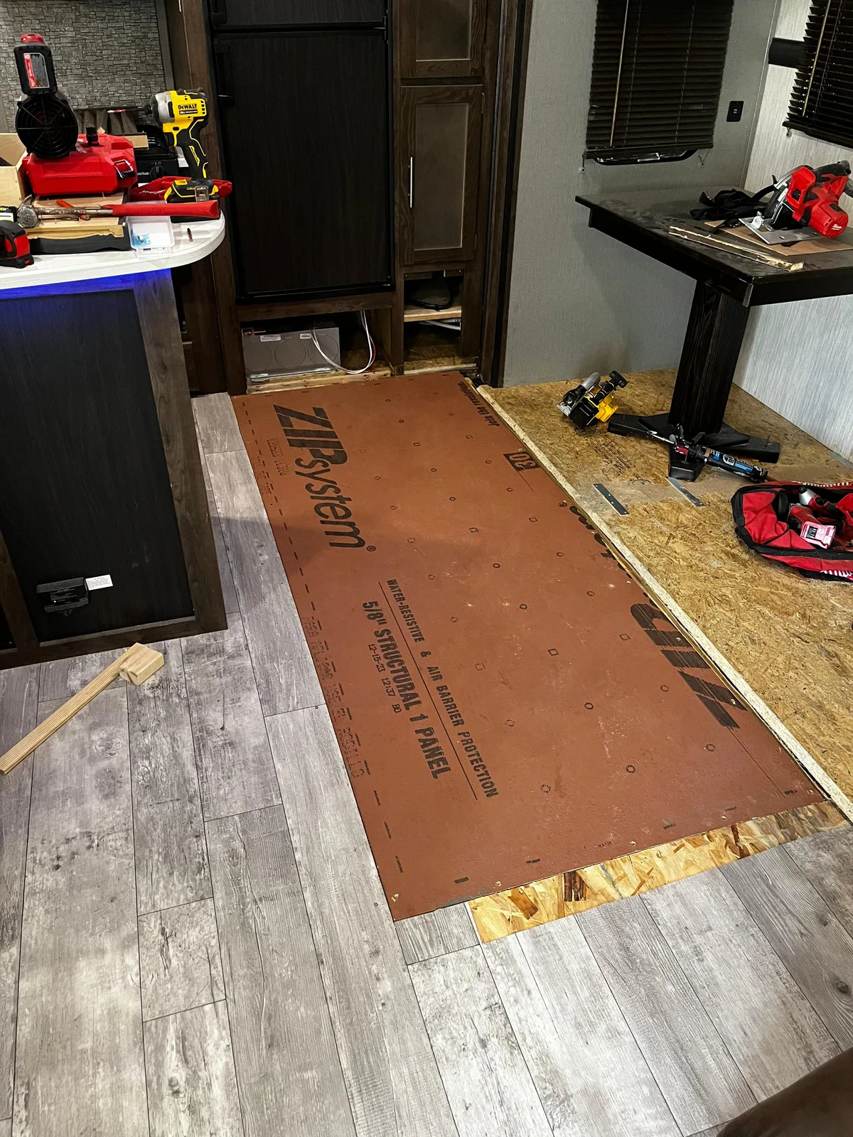 Triton RV technician fixing the floor after a water leak inside an RV
